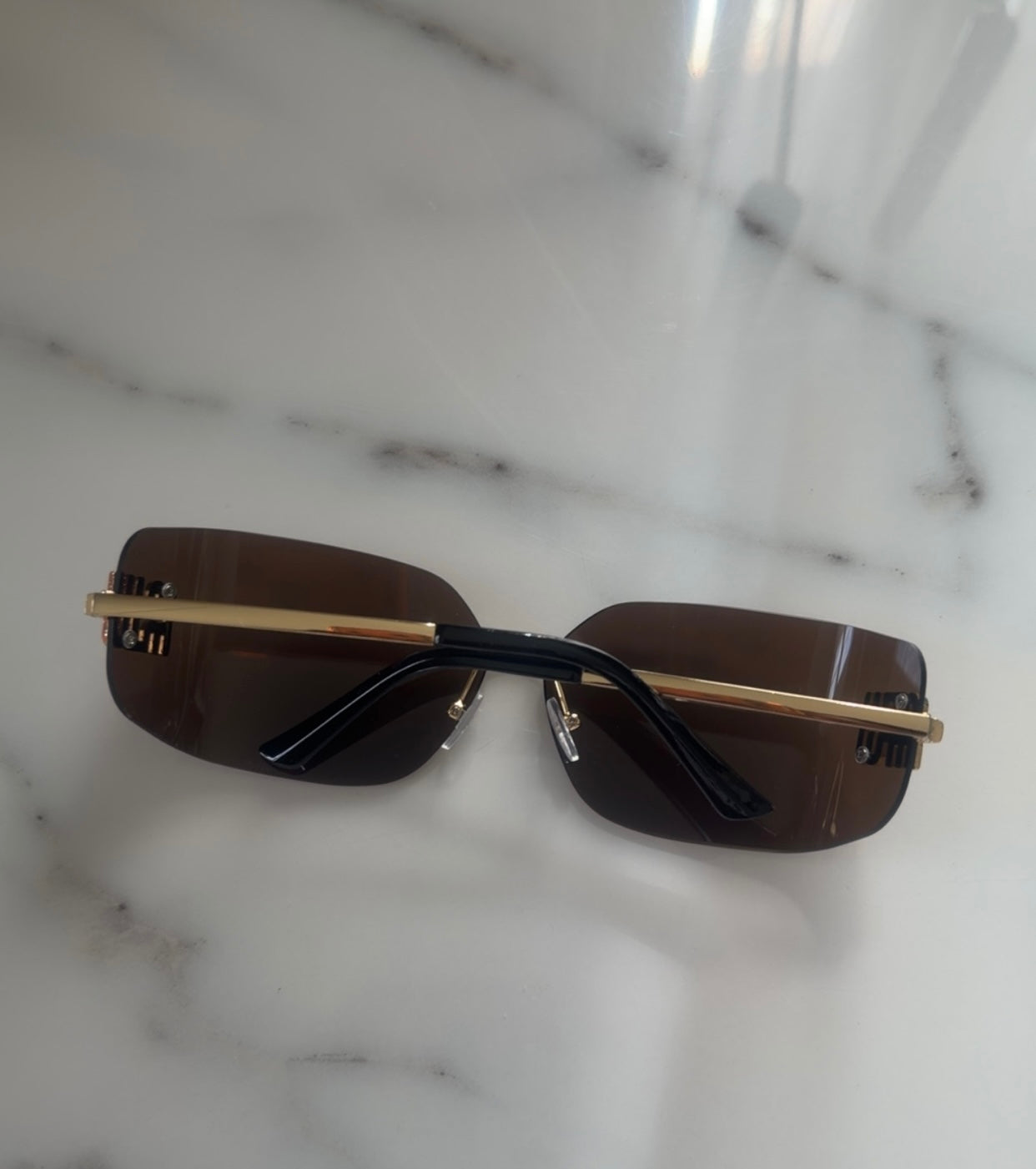 Modern Rimless Miu Miu Sunglasses